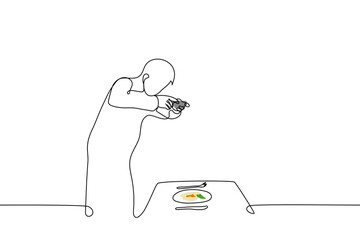 man taking food photo on phone - one line drawing vector. the concept of a chef making content for a culinary blog, a guy filming his food for social media