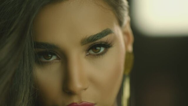 Close-up portrait of nice-looking  multi race beautiful elegant young woman looking at camera. Advertisement of Fashion with Young Woman . Fashion, beauty. Female portraits . Shot on ARRI ALEXA camera
