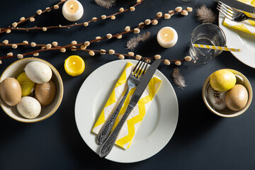 easter, holidays, tradition and object concept - close up of dinner party table serving over black background