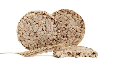 Fitness crispbread with ears of wheat isolated on white background. Healthy diet food. Whole grain crispy bread. Diet bread.