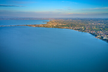 High altitude aerial view of the town of Sirmione on Lake Garda. Sirmione top view. Tourist place on Lake Garda aerial view.