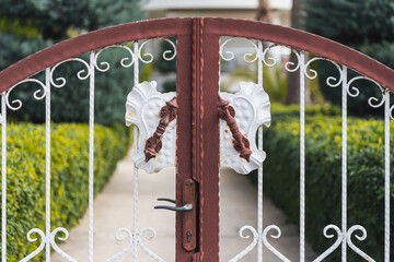 close-up of a beautiful  forged gate in a city park