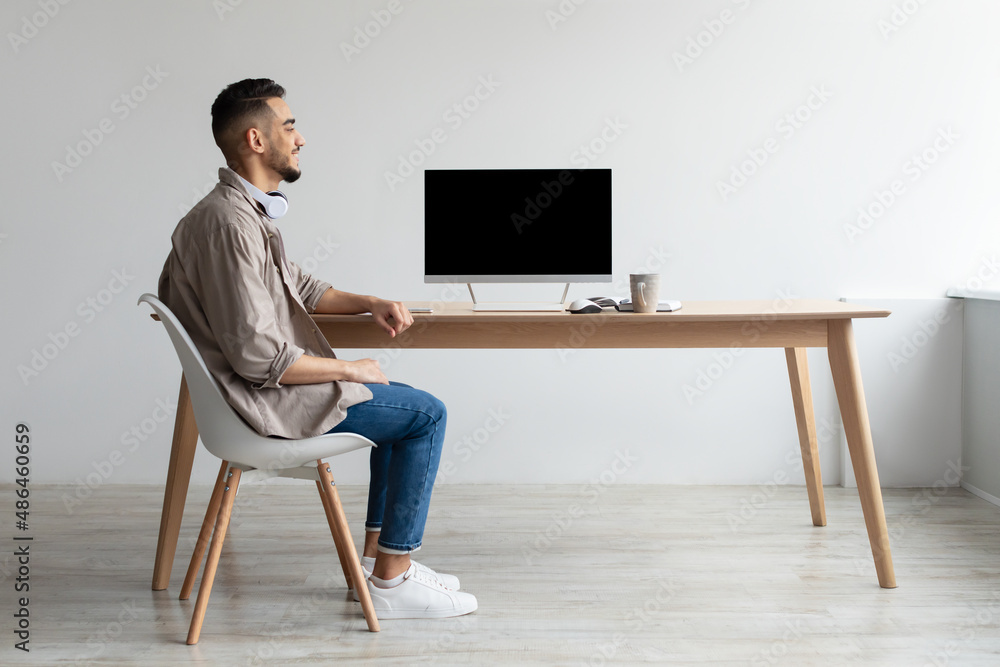 Aufkleber arab man looking at blank empty computer monitor