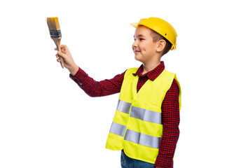 building, construction and profession concept - little boy in protective helmet and safety vest with brush over white background