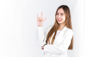 Young Asian cute woman in white suit looking at the camera acts exciting and symbol of love to...