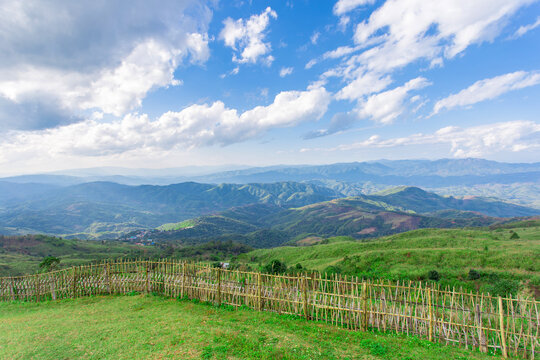 Natural view among of green forest and white cloud with blue sky. It is a border country area of Thailand and Myanmar.