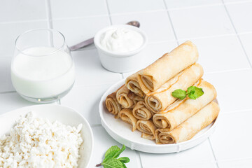Pancakes with cottage cheese on a white background.
