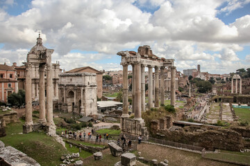 Naklejka na ściany i meble View from the Capitol to the Imperial Forums, the ruins of the Basilica of Julius and the temple of Saturn and the arch of Septimius Severus. Rome, Italy
