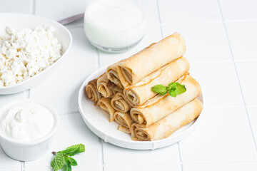 Pancakes with cottage cheese on a white background.