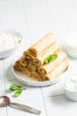 Pancakes with cottage cheese on a white background.