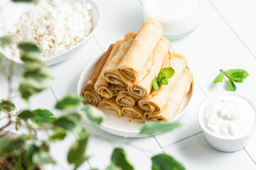Pancakes with cottage cheese on a white background.