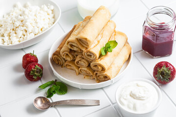 Pancakes with cottage cheese on a white background.