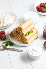 Pancakes with cottage cheese on a white background.