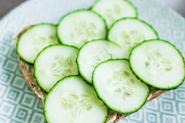 fresh cucumber sliced up on toast, simple ingredients concept