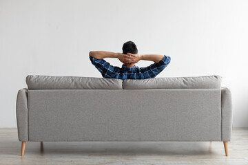 Man having rest at home on the couch
