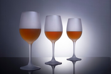 glasses with wine for wine on the table on a gray background