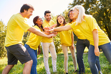 Stacking hands for motivation and team building in nature