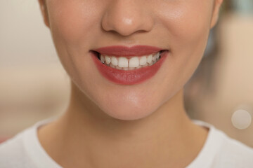 Happy young woman with white teeth, closeup