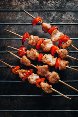 Grilled chicken kebabs with a sweet pepper on a metal tray