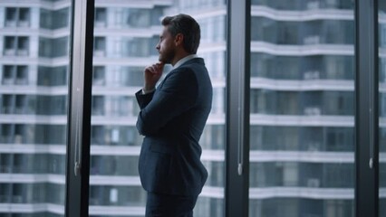 Boss man standing alone crossing hands thinking career in corporate building. - Powered by Adobe