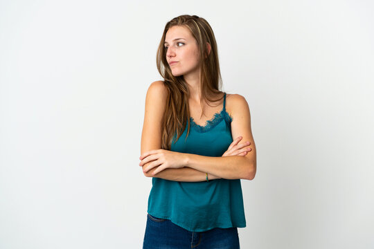 Young caucasian woman over isolated background keeping the arms crossed