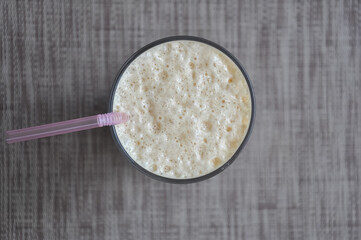 Top view of Lassi in glass over gray background with copy space 