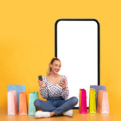 Female Shopping Near Big Cellphone Screen Using Smartphone, Yellow Background