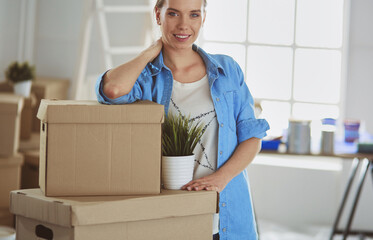 Portrait of a young woman with boxes