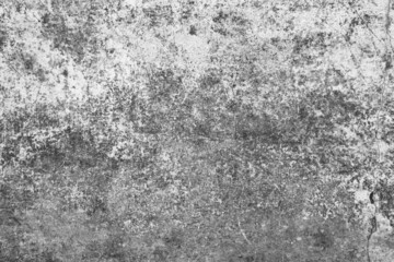 Old grunge dirty textured cement wall surface. With uneven stains and tiny holes.
