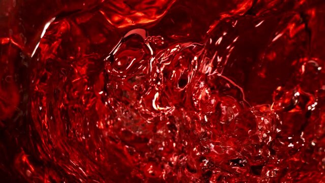 Super slow motion of red wine in whirl shape. Filmed on high speed cinema camera, 1000 fps.