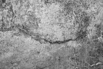 Old grunge dirty textured cement wall surface. With uneven stains and tiny holes.