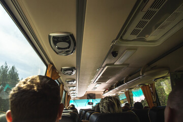 Row of air conditioning system in shuttle bus, making cool fresh air all inside the bus, soft focus