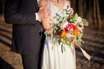 Bride and groom with boho bouquet