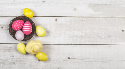 Naklejka na ściany i meble happy easter. holidays background nest with easter eggs decoration on wooden background
