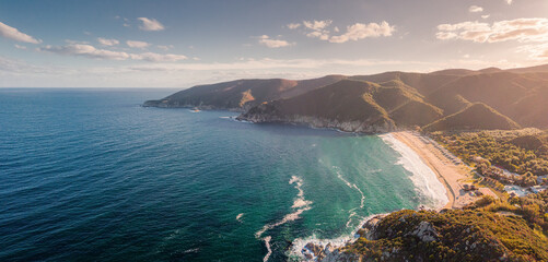 Aerial Panoramic view of one of the most iconic and popular beaches in the Halkidiki region - Kalamitsi on the Sithonia peninsula. Visiting Greece and vacation concept © EdNurg
