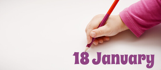 A child's hand writes 18 january in a lilac pencil. Banner with copy space