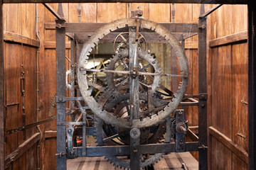 Fototapeta na wymiar Ancient Circular Iron Mechanisms for the Movement of the Mechanical Clock of a Tower