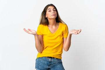 Young caucasian woman isolated on white background having doubts while raising hands