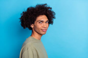 Obraz premium Profile side photo of youth handsome guy chevelure volume promoter isolated over blue color background
