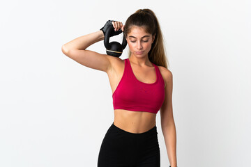 Young caucasian woman isolated on white background making weightlifting with kettlebell