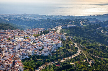 View of famous white village - pueblo blanco - called Frigiliana. White houses in small village in the mountains.