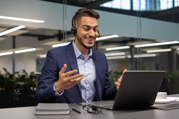 Positive middle eastern manager having video call with business partners
