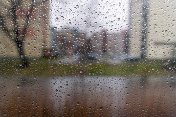 Water drops on window in rainy day.