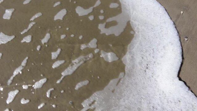 Shame washed away by living water from the ocean beach