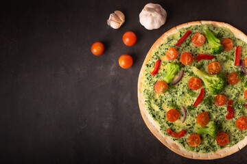 Homemade pizza vegetarian. Top view with copy space on dark stone table