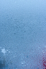 Condensation on the clear glass window. Water drops. Rain. Abstract background texture. Outside the window, bad weather, rain