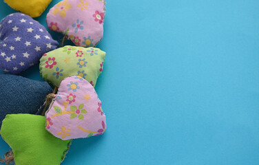 cute hearts sewn from fabric for any holiday on a blue background