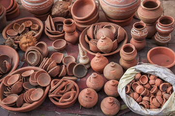 assortment of various cups, dishes made from clay at street market in New Delhi