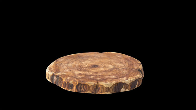 Round wooden stand isolated on a black background. Wooden product display podium