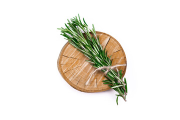 Rosemary bound. Round wooden board with bound rosemary on white isolated background. Flat lay, top view image with copy space.